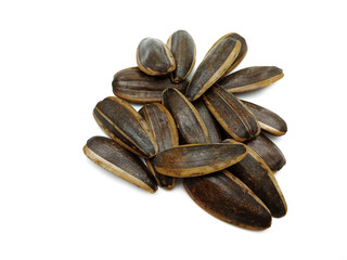 Sunflower seeds pile against isolated on white background. Roasted and Salted in the original flavor. Great nutritous and rich with oil which makes it a high energy source. Snack for diet and healthy.