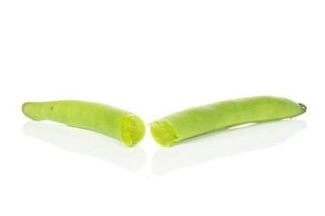 Group of two halves of bright snap green bean isolated on white background