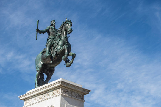 bronze equestrian sculpture of Felipe IV cropped on background sky