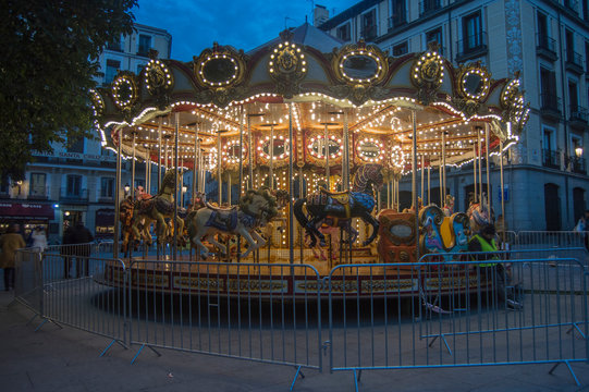 a Christmas carousel illuminated at night insquare in  Madrid. Spain