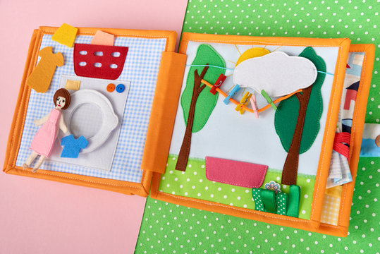 CHILDREN'S TEXTILE TRAINING BOOK. TOY WASHING MACHINE AND DRYER FOR THINGS IT IS MADE OF FELT