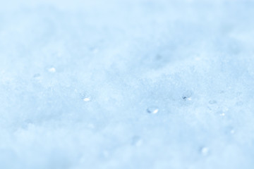 abstract winter background with snow in bright blue