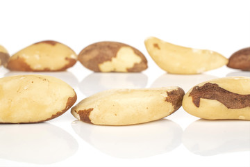 Lot of whole unshelled brazil brown nut isolated on white background