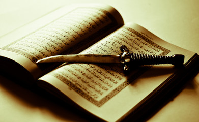 a knife on the open Koran
