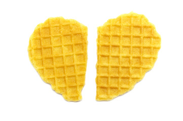 Waffle crisp butter flavor biscuits isolated on white background. Heart concept.