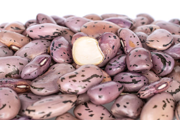 Lot of whole organic fresh speckled bean pinto isolated on white background