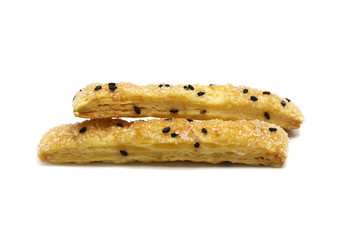 Pie or Bread stick with black sesame isolated on white background.