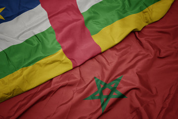 waving colorful flag of morocco and national flag of central african republic.