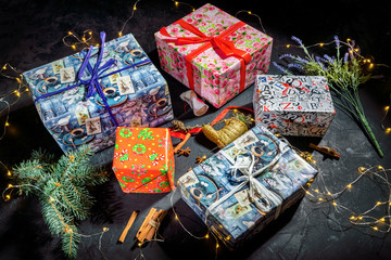 Christmas gift boxes on dark background. Luxury new year gift. Christmas background with gift box