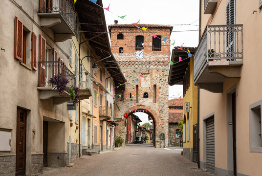 a street and the bell tower in Piverone town, Turin, region Piemonte, Italy