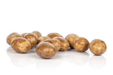 Lot of whole tiramisu brown almond nut stack isolated on white background