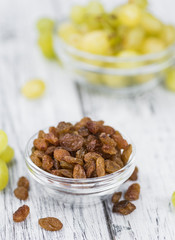 Portion of healthy Raisins (selective focus; close-up shot)