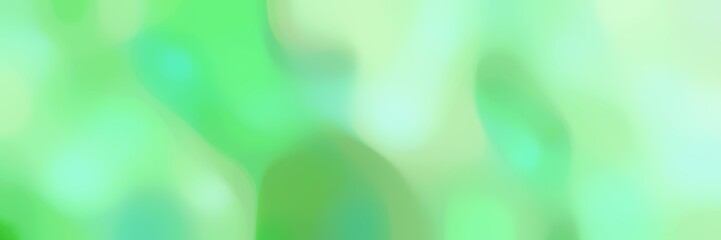 soft blurred iridescent horizontal background with light green, pale green and pale turquoise colors space for text or image