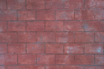 Obraz premium Red toned brick wall texture background. Beautiful dusty concrete blocks. Close up, copy space 