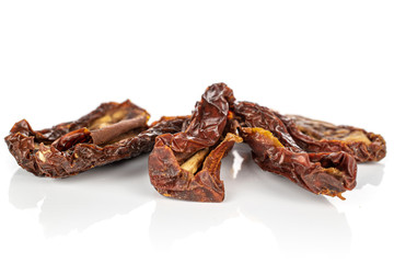 Group of four whole dried red tomato piece isolated on white background