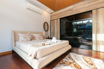 Modern bedroom with working desk and bedding