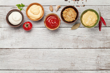 Fototapeta na wymiar Set of various sauces. Popular sauces in bowls