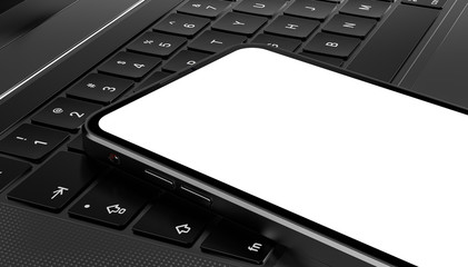 Smartphone frame less blank screen lying on laptop keyboard - mockup template