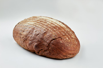 Bread on white background. Loaf of rye bread. Space for text.