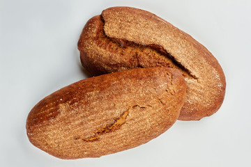 Two loaves of bread on white background. Traditional homemade bread.