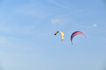 colourful kitesurf in the blue sky