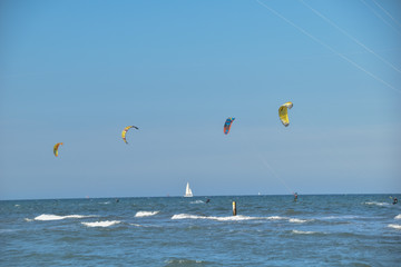 kitesurf and a wind boat on the sea