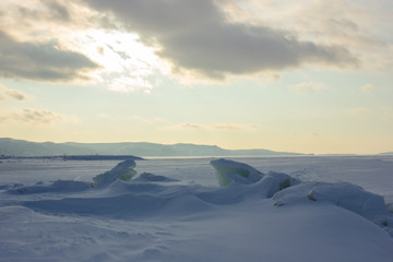 Winter snowy landscape with the plain and the sky