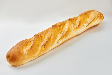 Baguette on white background and copy space. Long french bread. Crusty french baguette recipe.