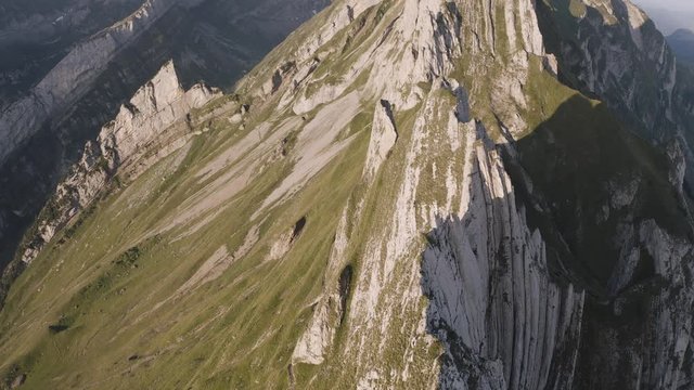 4K Aerial of scenic mountain landscape during sunrise. 