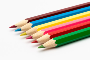 Colorful color wooden pencils on a white background