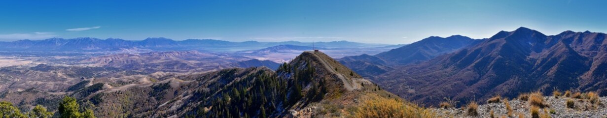 Wasatch Front Rocky Mountain landscapes from Oquirrh range looking at Utah Lake during fall. Panorama views near Provo, Timpanogos, Lone and Twin Peaks. Salt Lake City. United States.
