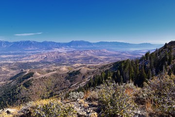 Wasatch Front Rocky Mountain landscapes from Oquirrh range looking at Utah Lake during fall. Panorama views near Provo, Timpanogos, Lone and Twin Peaks. Salt Lake City. United States.