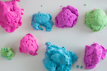 Colorful molded plasticine clay isolated on white background