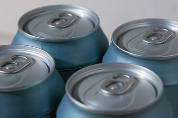 beer packaging. silver blue beer cans. aluminum cans background