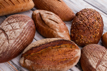 Fresh bread loaves background. Artisan bread loaves. Homemade bread recipe.