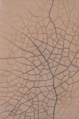 Cracked enamel. Old pottery. Cracks on a smooth surface.