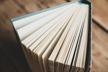 books page on the wooden desk background