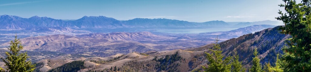 Naklejka premium Wasatch Front Rocky Mountain landscapes from Oquirrh range looking at Utah Lake during fall. Panorama views near Provo, Timpanogos, Lone and Twin Peaks. Salt Lake City. United States.