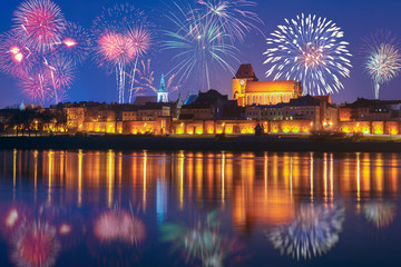 New year celebrate fireworks over Old Town of Torun. Poland, Europe © vivoo