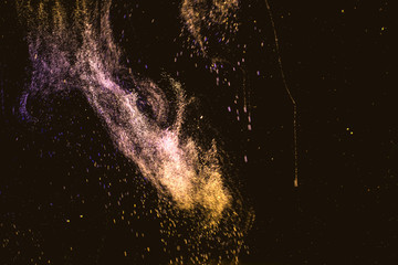 Dance of small gas bubbles in a colored liquid. Bubbles of gas in the wine. Carbonated Christmas drink. Nebula, star cluster in the dark sky.