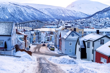 Tromso, Norway. View of the arctic city with traditional wooden houses in winter.