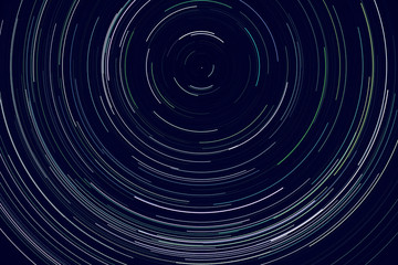 star trails -  light streaks of stars around Polaris in the night sky due to Earth's rotation