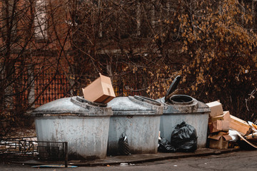overflowing garbage container. trash cans in the city.