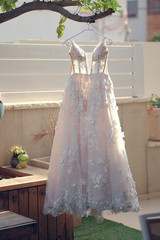 Wedding dresses hanging on a hanger.
