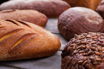 Whole grain artisan bread. Bread with pumpkin seeds close up. Healthy homemade product.
