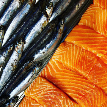 Anchovies And Salmon At The Grocery Store's Fish Counter