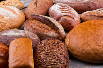 Loaves of healthy organic bread close up. Variety of homemade natural bread.