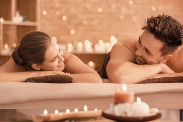 Rolgordijnen Young couple relaxing in spa salon © Pixel-Shot