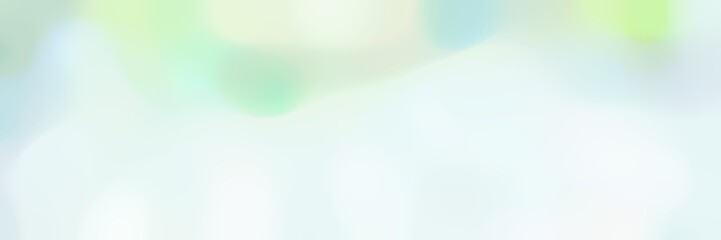 blurred bokeh horizontal background texture with honeydew, powder blue and tea green colors and free text space