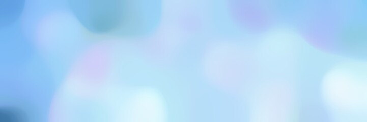 blurred bokeh iridescent horizontal background with powder blue, sky blue and corn flower blue colors space for text or image